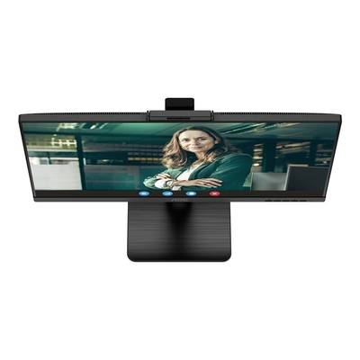 Moniteur affichant la capture d'écran d'une conversation : Une personne dans un bureau portant un blazer et souriant à la caméra.