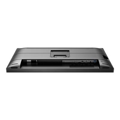 Moniteur noir vu de dos avec des ports visibles tels que HDMI, USB et un port câble au centre.