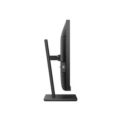 Un moniteur d'ordinateur noir vu de côté, qui montre son design élégant et moderne avec un support fin.