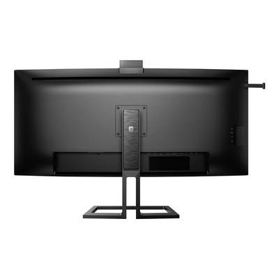 Vue arrière d'un grand moniteur noir sur un support métallique, avec une connexion de câble sur le côté droit et un tube central de support.