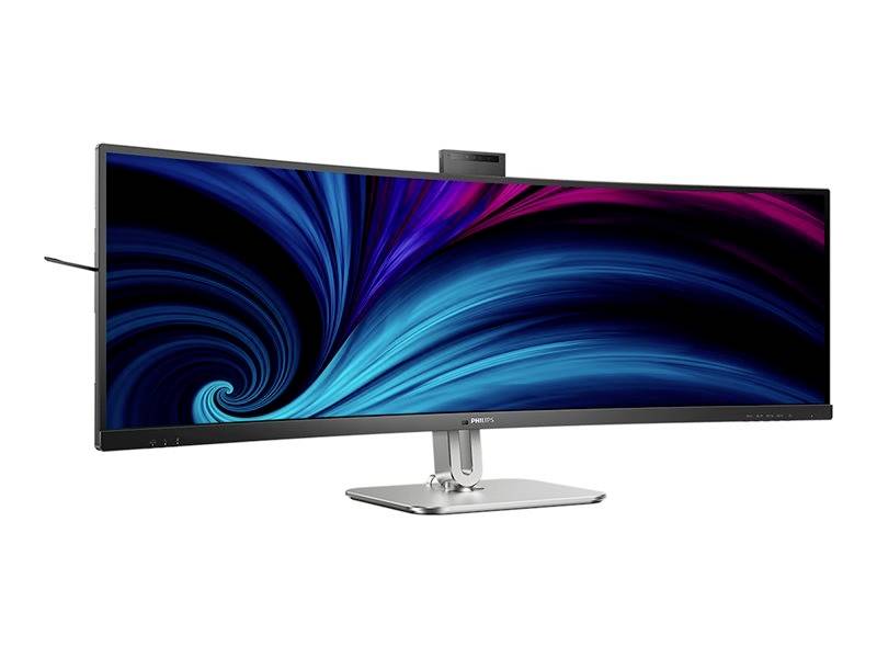 Un écran d'ordinateur ultra-large affiche une représentation dynamique et abstraite en tons de bleu et de rouge. Le moniteur présente un design élégant et moderne.