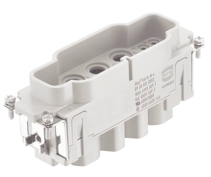 Un connecteur électrique rectangulaire gris avec plusieurs ouvertures de connexion et des vis de fixation de câble.