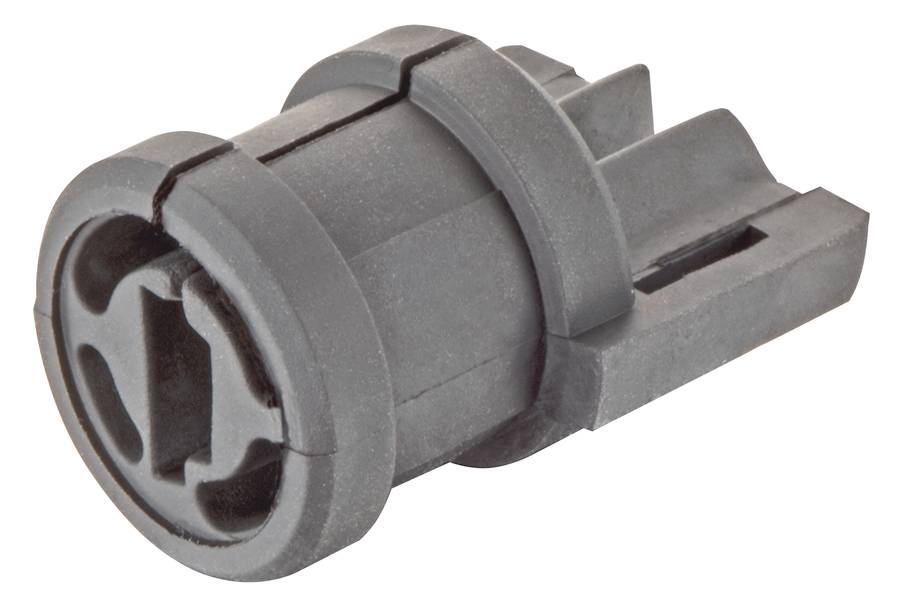 Pièce de construction en plastique gris, cylindrique avec plusieurs rainures et un motif en croix sur la face avant, à usage industriel.