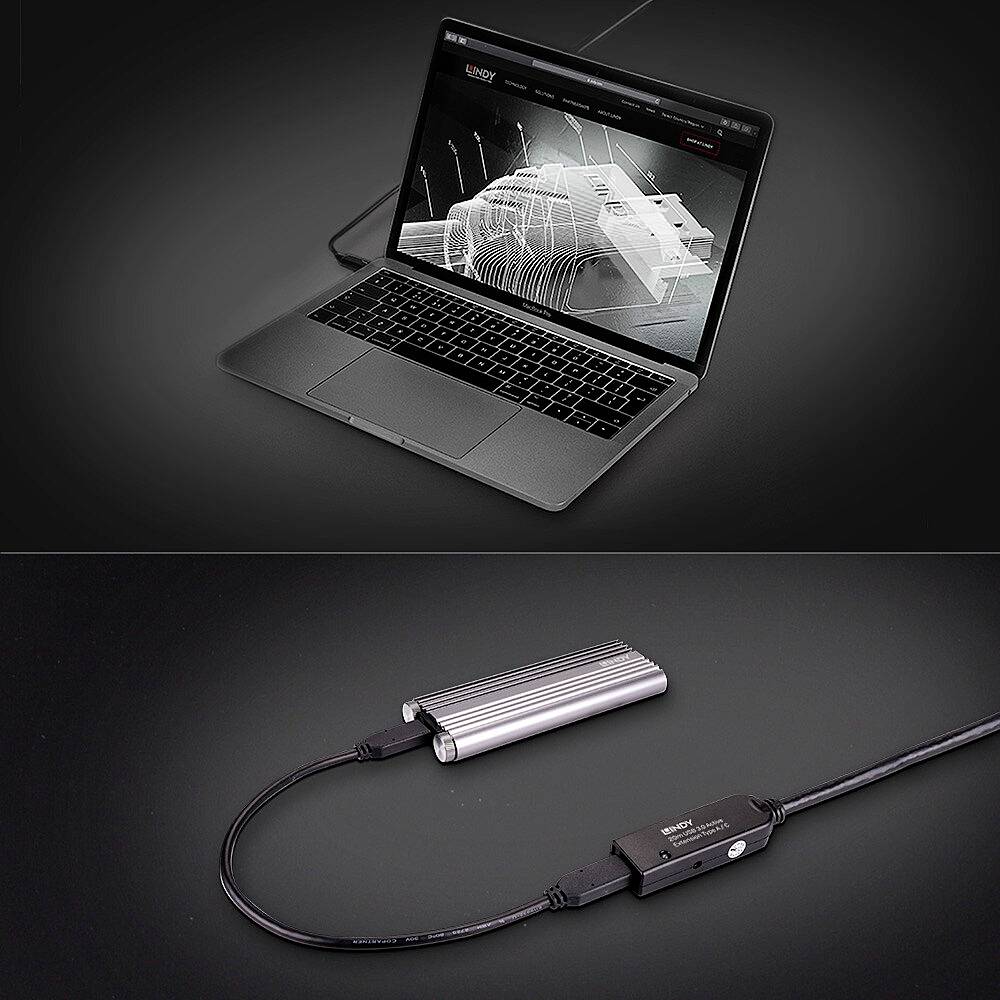Un ordinateur portable ouvert affiche un modèle CAO sur son écran. Un hub USB-C est posé devant, connecté à l'ordinateur portable.