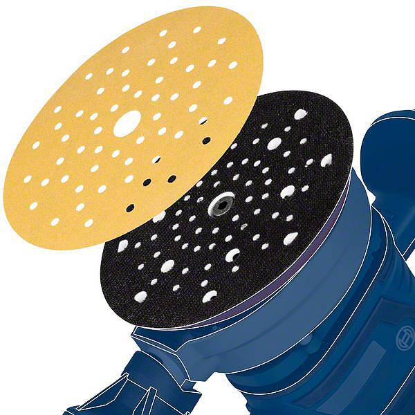 Un tuyau d'aspirateur avec un disque de ponçage noir et un autre jaune au-dessus, tous deux percés, illustrant un procédé de ponçage.