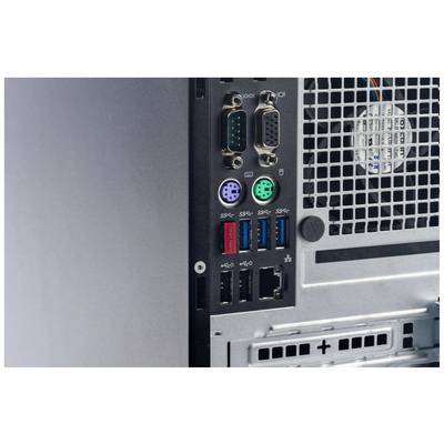Arrière d'un boîtier d'ordinateur avec différents ports, notamment des ports série, PS/2, USB et une grille d'aération.