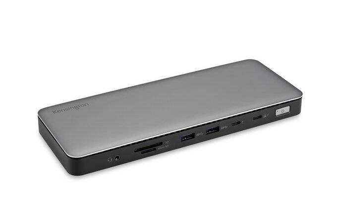 Station d'accueil plate en argent avec plusieurs ports : USB, HDMI et prise audio. Marquée 'Kensington'.