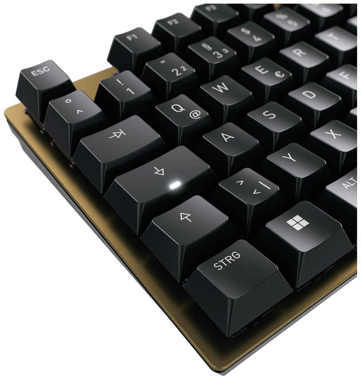 Clavier d'ordinateur avec touche fléchée rétroéclairée et design noir sur une plaque dorée. Mise au point sur les touches Échap et Contrôle.