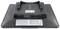 Verso d'un moniteur avec plusieurs ports et étiquettes, incluant un port USB et un indicateur de charge, sur un boîtier noir.