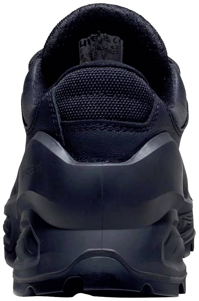 Vue arrière d'une basket noire avec semelle épaisse et matériau en maille.