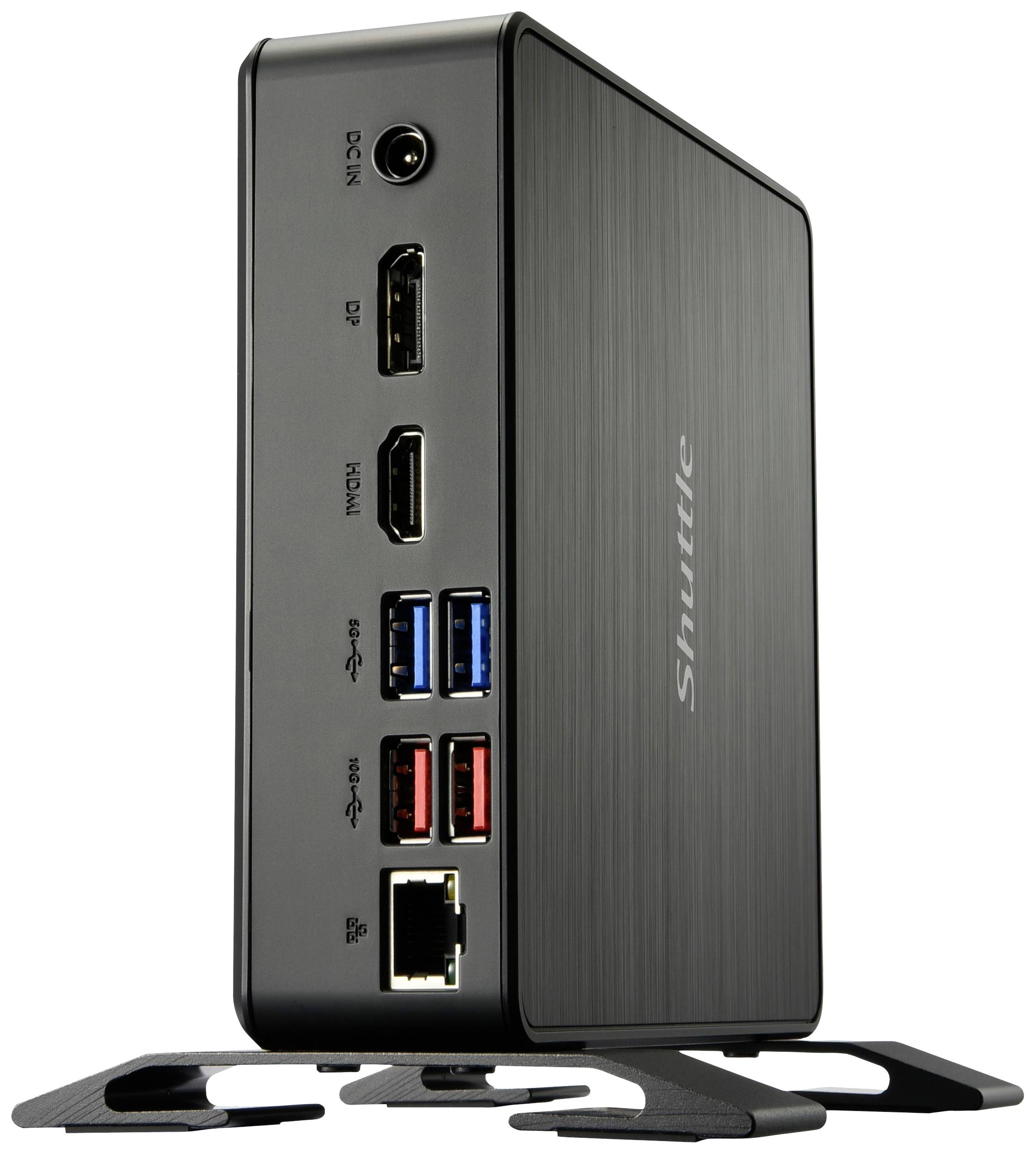 Un mini PC noir avec plusieurs options de connexion : DP, HDMI, ports USB et port Ethernet. Le logo de la marque 'Shuttle' est visible sur le côté.
