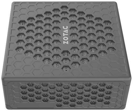 Appareil électronique gris avec des fentes de ventilation hexagonales et le logo 'Zotac' en haut.