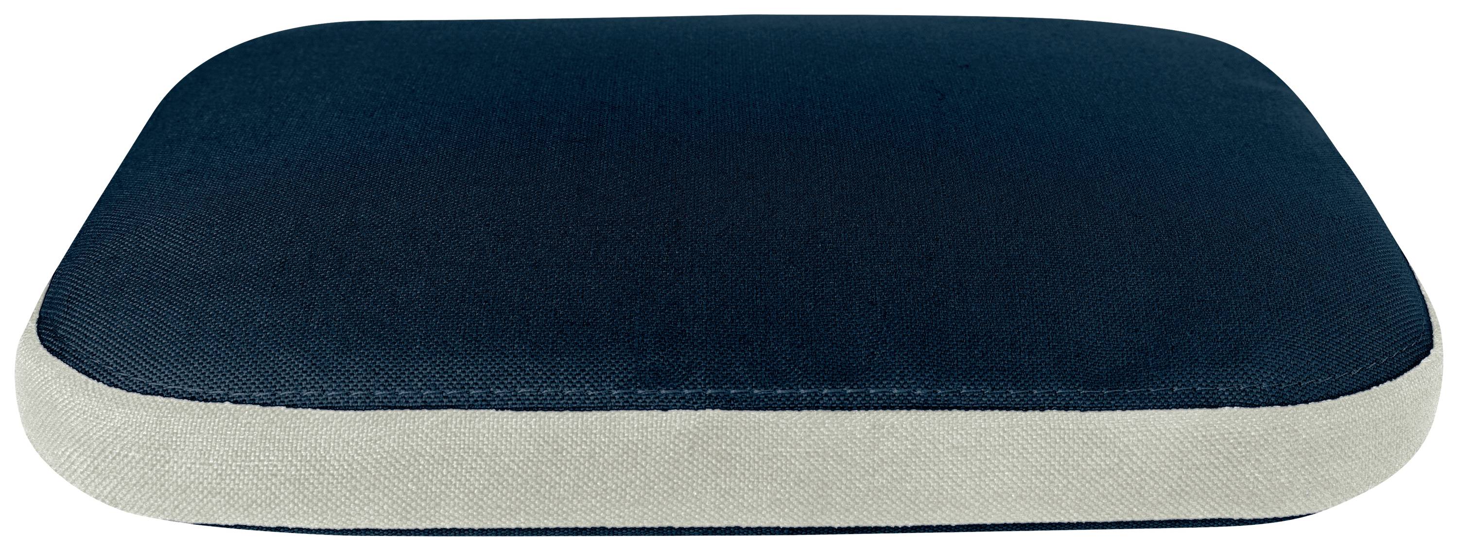 Coussin rectangulaire bleu foncé avec un bord clair, posé à plat sur une surface.