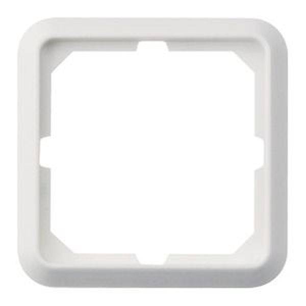 Un cadre en plastique blanc, carré, avec des bords biseautés et quatre petits points de verrouillage dans les coins.