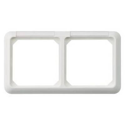 Un cadre double rectangulaire blanc en plastique pour montage mural. Adapté pour deux prises de courant ou interrupteurs.