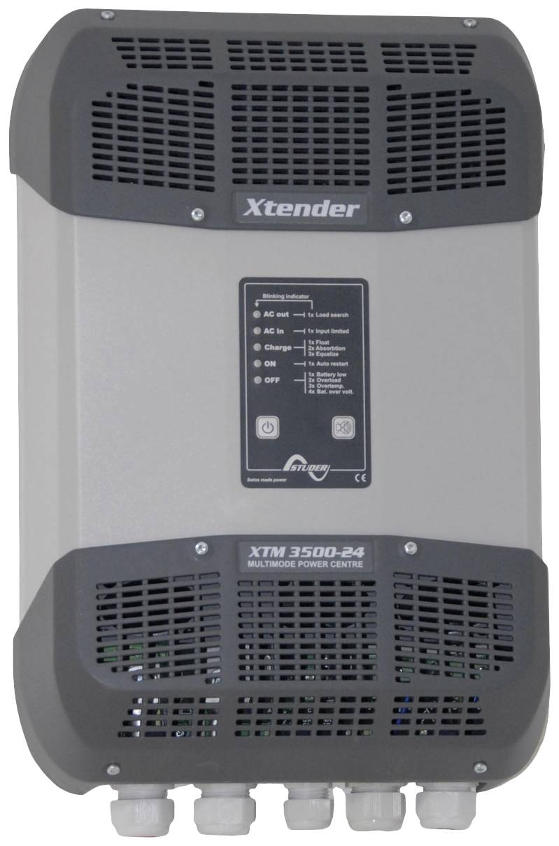 Un onduleur gris Xtender XTM 3500-24 avec des ouvertures de ventilation et des connexions en bas, affichant des voyants d'état de fonctionnement sur l'avant.
