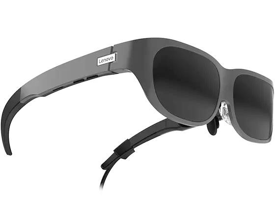Lunettes VR noires à monture épaisse. Sur les branches est inscrit 'Lenovo'.