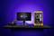 Un ordinateur jaune avec l'intérieur illuminé est placé à côté d'un moniteur arborant le logo 'Thermaltake', sur un bureau d'ordinateur avec un clavier et une souris.