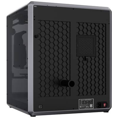 Boîtier d'ordinateur noir avec motif hexagonal ; vue arrière montrant une grille de ventilation et des interrupteurs ; le matériau principal est le métal.