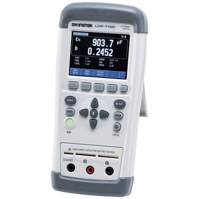 Appareil numérique de mesure LCR avec affichage de '903,7 µF' et '0,2452'. Les commandes et les options de connexion sont visibles.