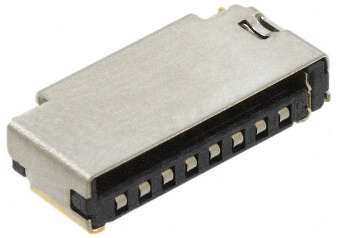 Un petit connecteur électronique rectangulaire avec un boîtier métallique et plusieurs broches, généralement utilisé dans les appareils électroniques pour les connexions.