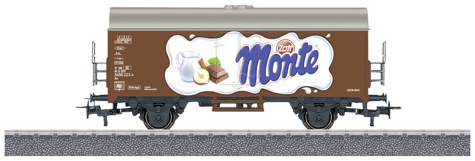 Un wagon de marchandises portant l'inscription 'Monte' et une illustration de lait, de chocolat et de noisettes.