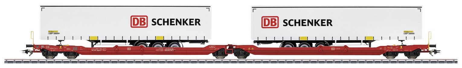 Deux conteneurs blancs de DB Schenker sur un wagon de fret ferroviaire.