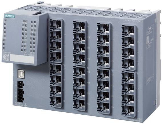 'Module SPS avec plusieurs connexions réseau ; logo Siemens visible en haut à gauche. Appareil de contrôle et de mise en réseau dans un environnement industriel.'
