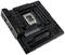 Carte mère noire avec un socket CPU au centre, entourée de plusieurs emplacements et connecteurs. Marquage 'TUF Gaming'.