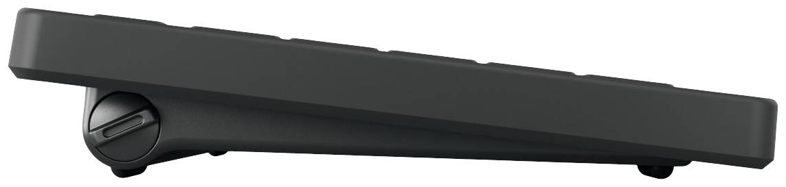Un clavier noir et élancé, vu de côté, avec un angle d'inclinaison réglable grâce à un pied pivotant sur le côté gauche.