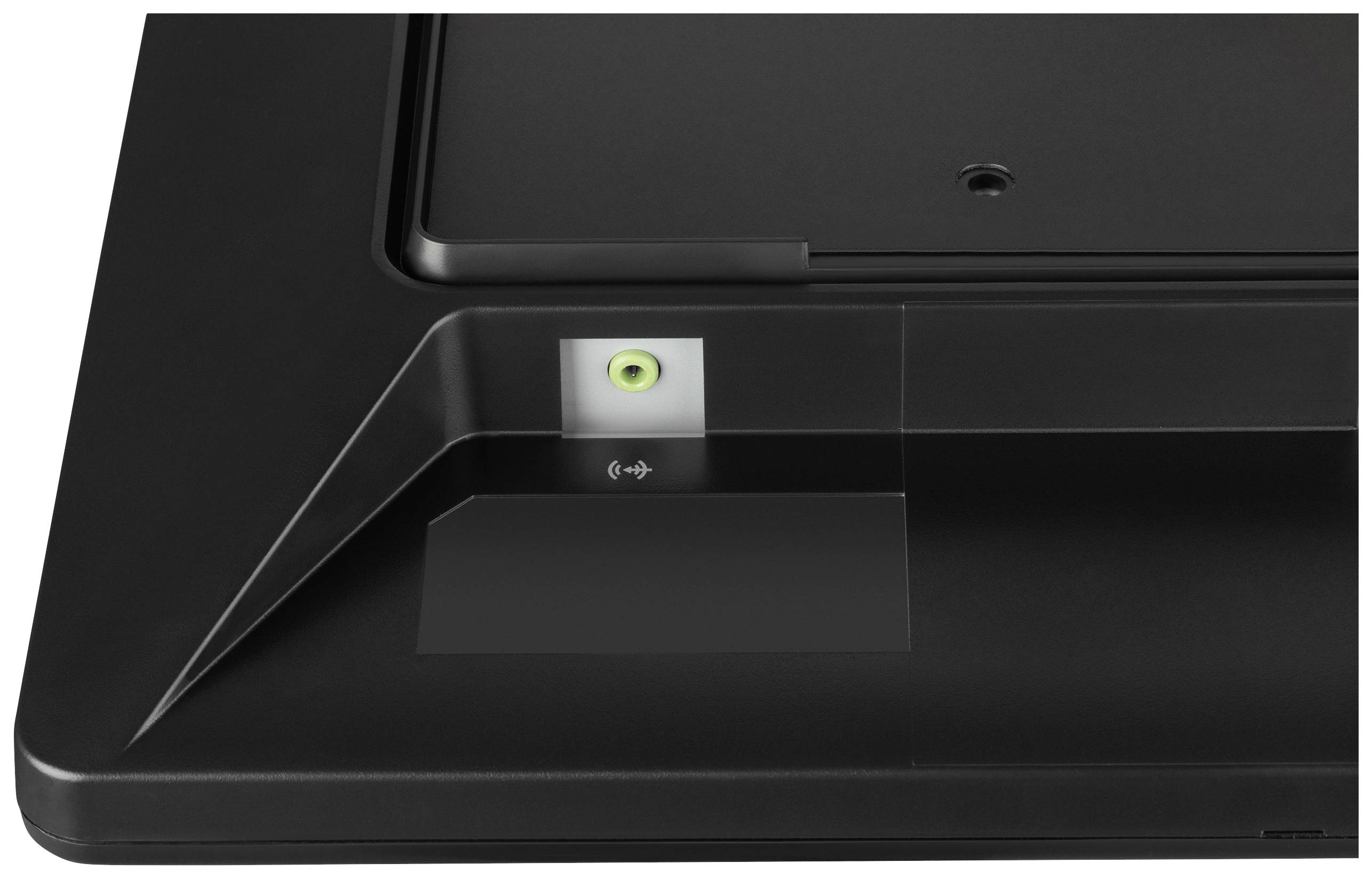 Une surface de périphérique noire avec un petit bouton vert et un symbole de connexion sans fil dans un coin.