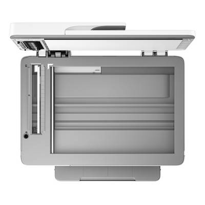 Un scanner à plat ouvert, vu de dessus. La surface de numérisation et le couvercle sont visibles.