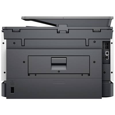 Vue arrière d'une imprimante multifonction avec le couvercle du scanner ouvert, montrant les connexions pour le câble réseau et le câble d'alimentation électrique.
