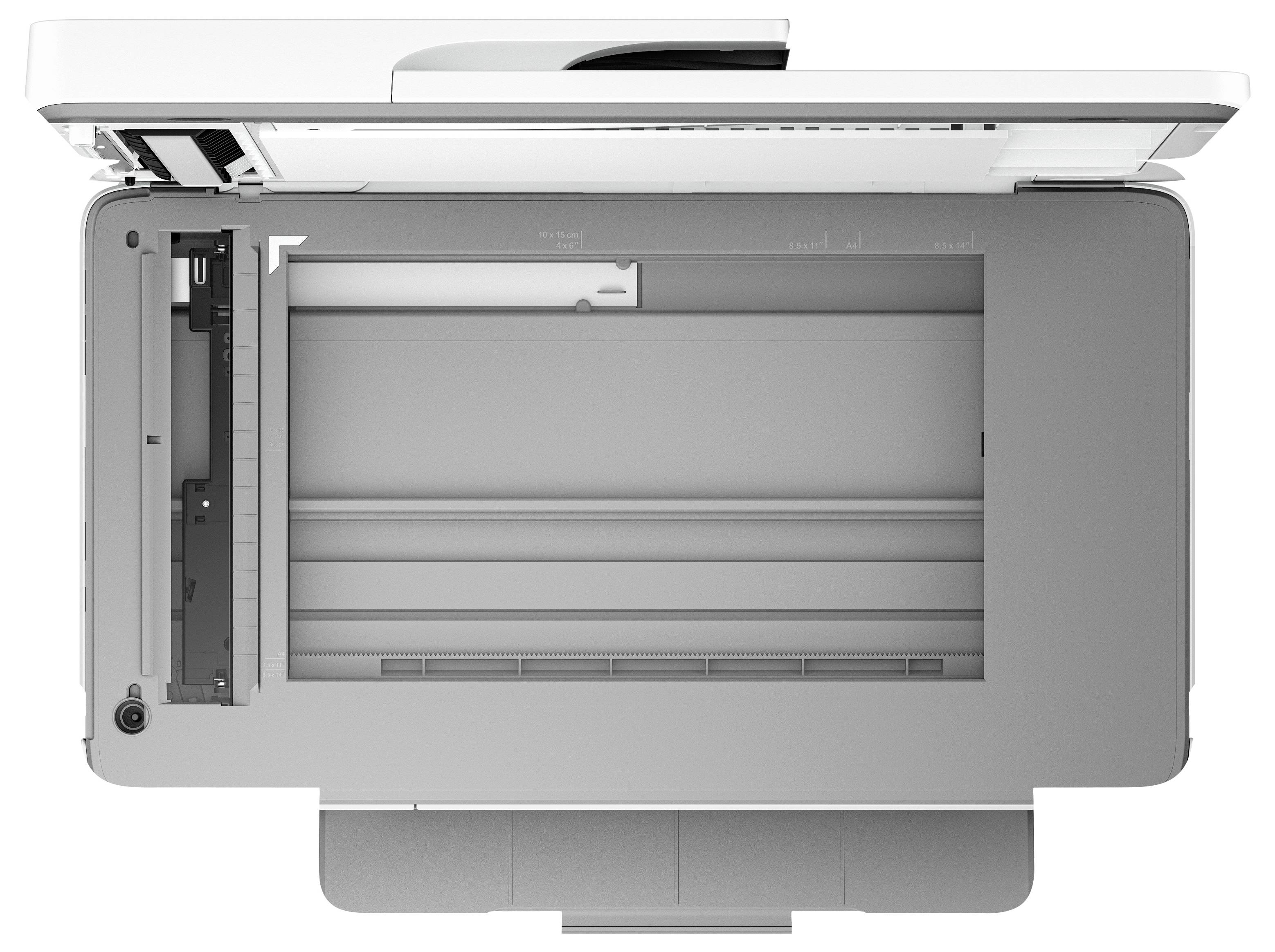 Vue de dessus d'une imprimante/numériseur de bureau ouverte avec le couvercle du bac d'alimentation relevé, montrant le plateau papier et la zone de numérisation interne.