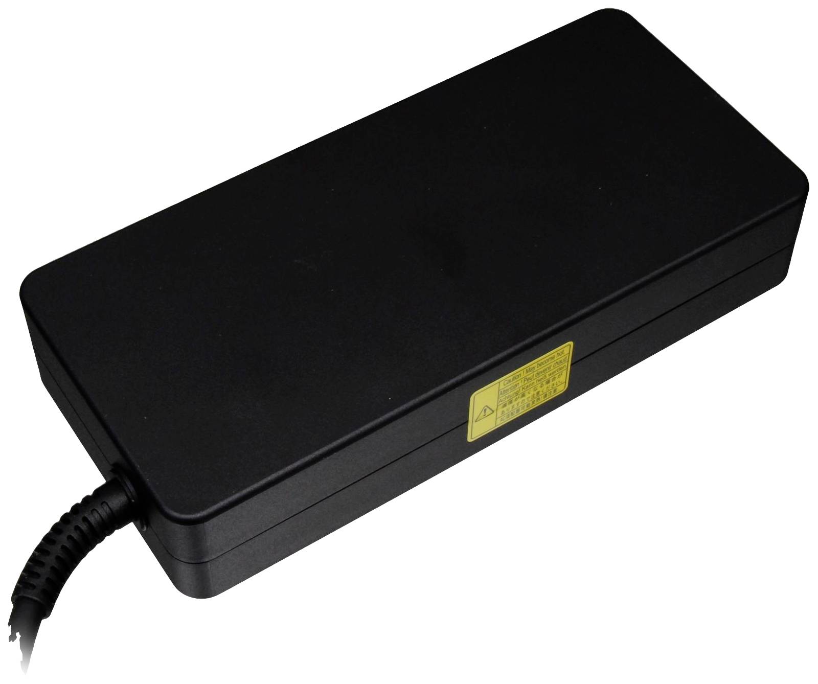 Bloc d'alimentation noir avec câble, autocollant d'avertissement jaune sur le côté, forme rectangulaire.