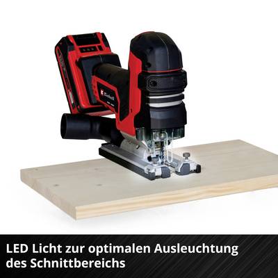 Une défonceuse électrique sur une planche en bois, mise en valeur par un éclairage LED pour un éclairage optimal de la zone de coupe.