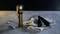 Une lampe de poche est posée sur une table à côté d'une serviette et d'outils.