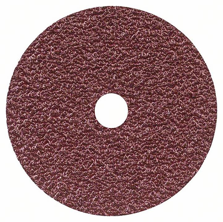 Une meule ronde, brune, à surface rugueuse.
