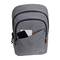 Un sac à dos gris avec une poche avant contenant un smartphone et un carnet de notes.