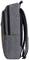 Sac à dos gris en vue de profil avec compartiments à fermeture éclair et sangles d'épaules rembourrées, adapté à un usage quotidien.