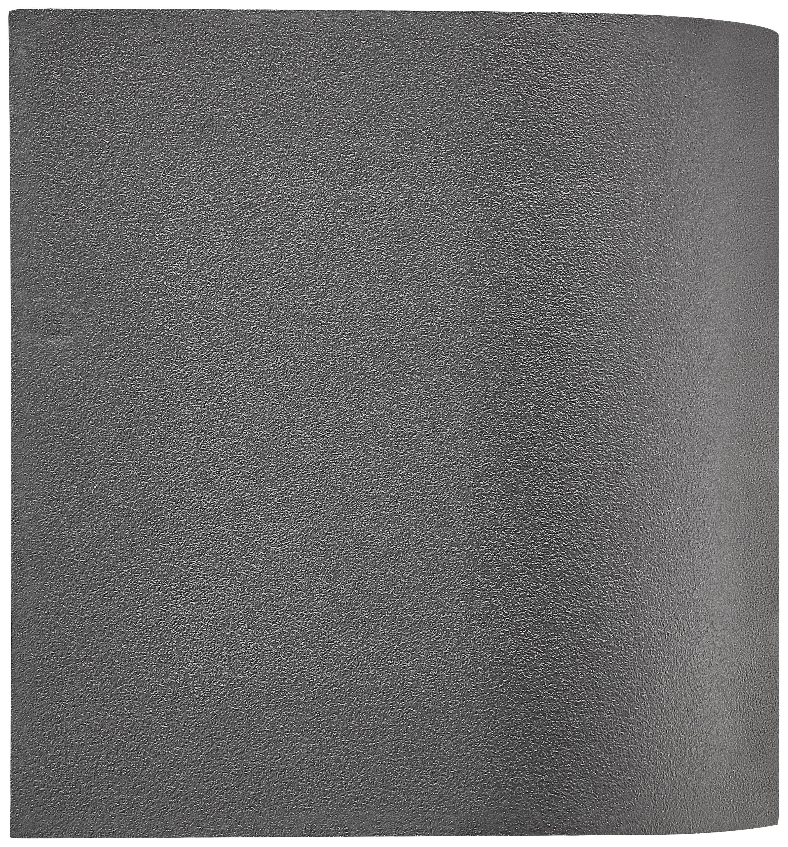 Une feuille de papier rectangulaire, gris foncé, avec une texture légère et une légère courbure sur le côté droit.