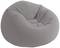 Fauteuil gonflable gris de style lounge, à la forme et à la texture douces et arrondies, idéal pour des moments de détente intérieure.