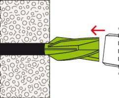 Principe de fonctionnement de la technique de cadrage : Une cheville est vissée dans un mur structuré, le graphique montre la direction de la vis.