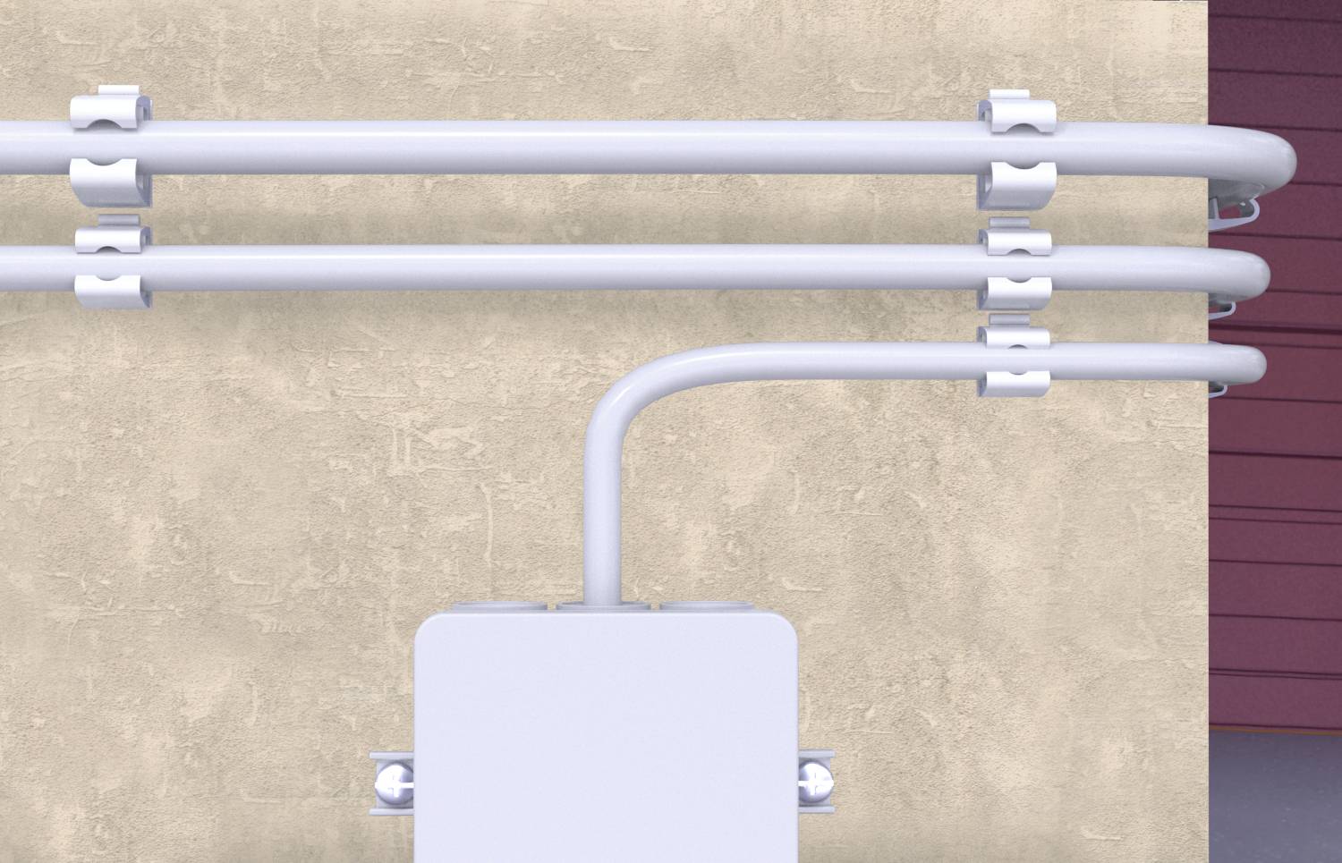 Trois tuyaux blancs sont disposés parallèlement au mur. L'un d'eux est relié à un tuyau vertical qui mène à un caisson rectangulaire.