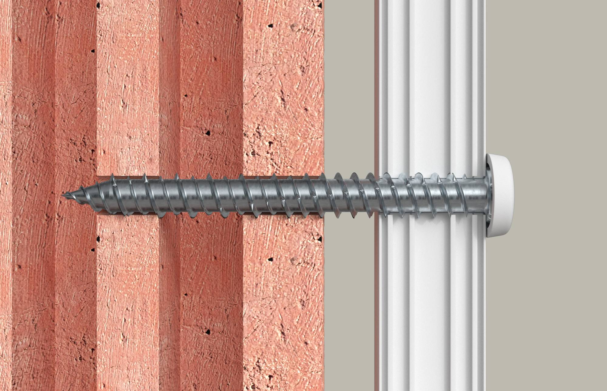 Vis en acier fixant un accessoire blanc à un mur de briques, montrant la vis pénétrant le mur et s'enfonçant dans le composant monté.