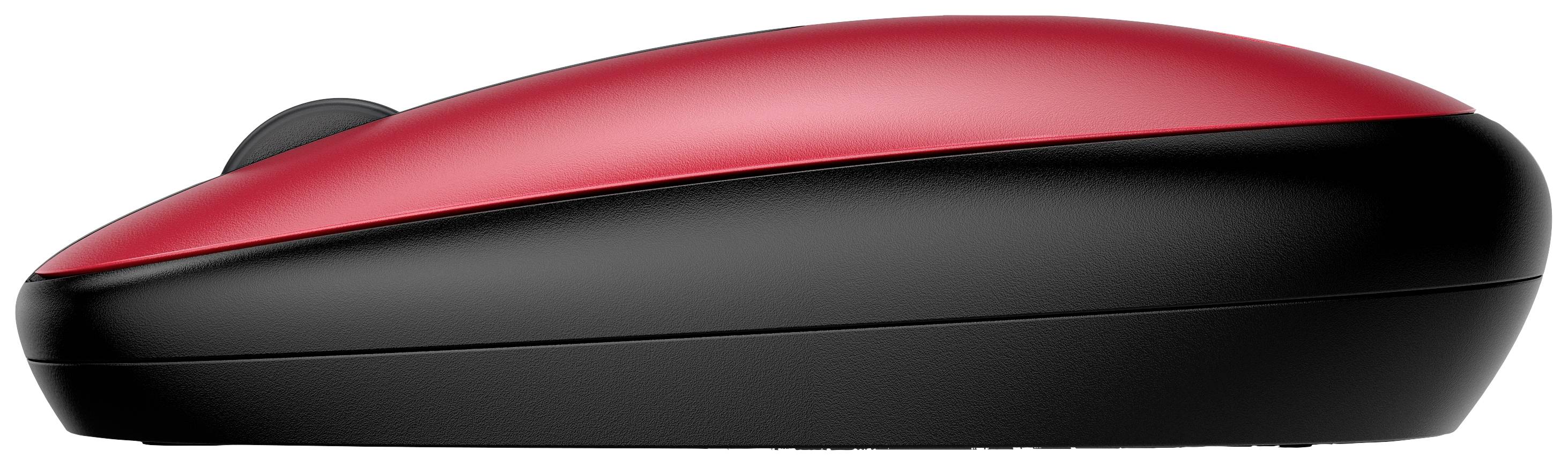 Une souris d'ordinateur rouge et noire, photographiée de profil.