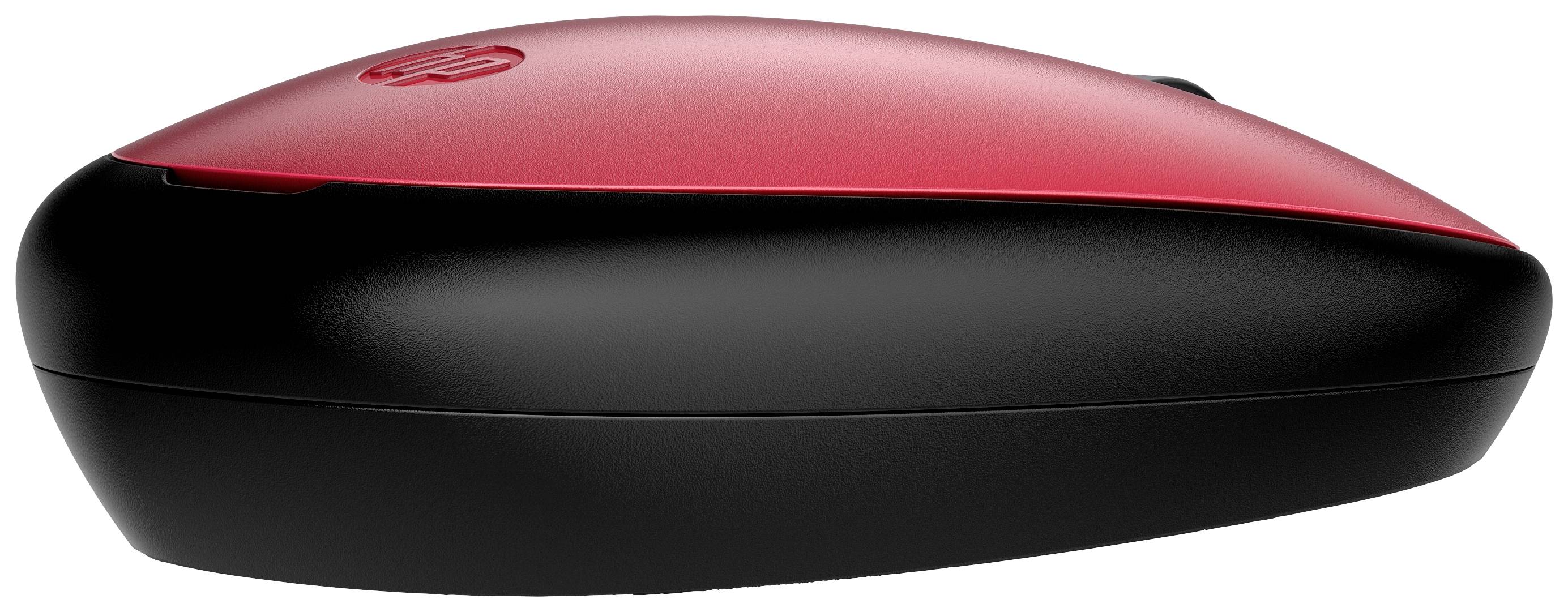 Souris d'ordinateur sans fil, rouge et noire, vue de côté. Surface lisse et design élégant.