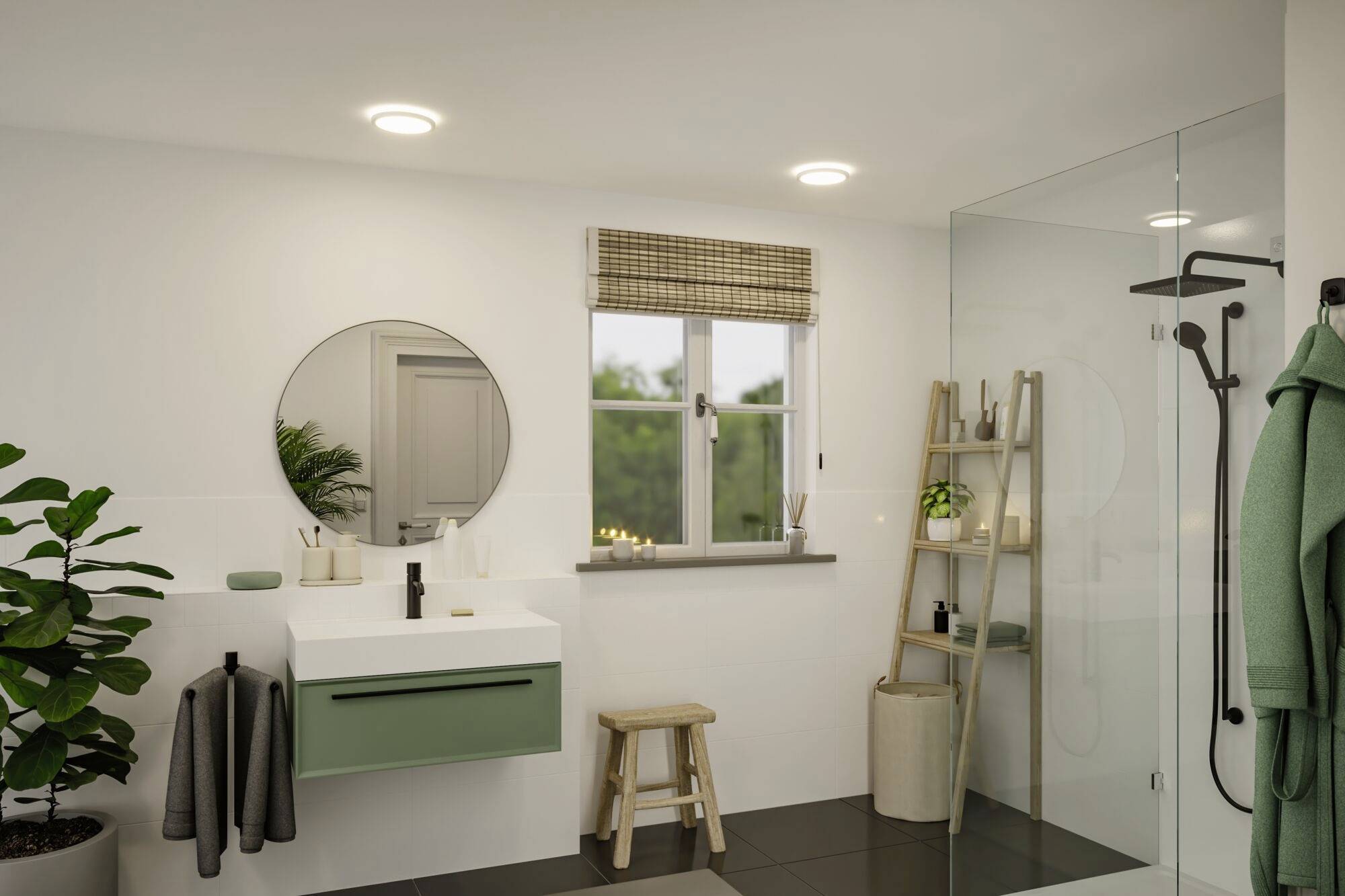 Une salle de bain moderne avec un miroir rond au-dessus d'un lavabo vert, une douche à paroi vitrée et des plantes en décoration.