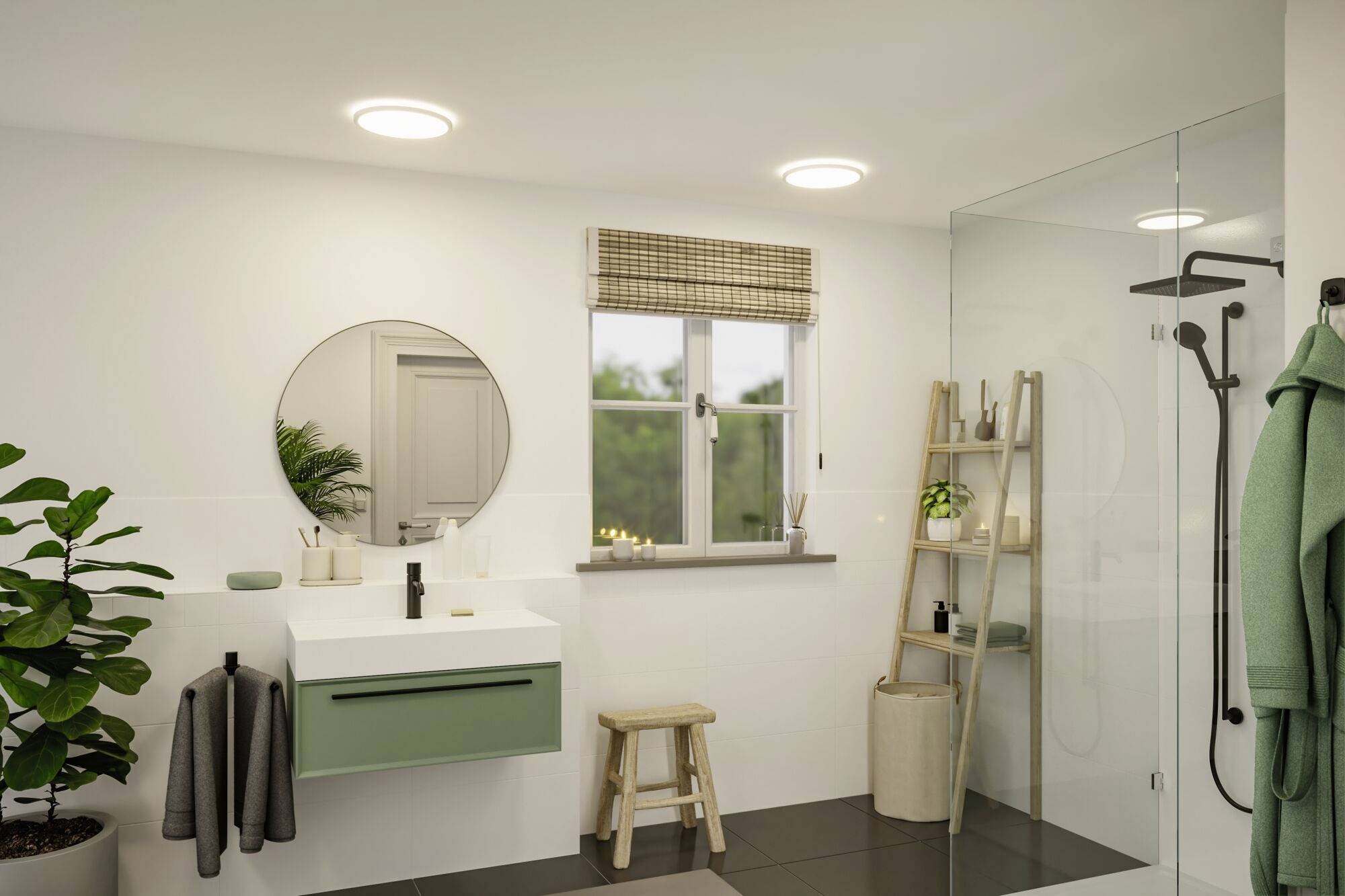 Salle de bain moderne avec lavabo vert, miroir rond, plantes et douche en verre. Fenêtre avec store et tablette de bougies.
