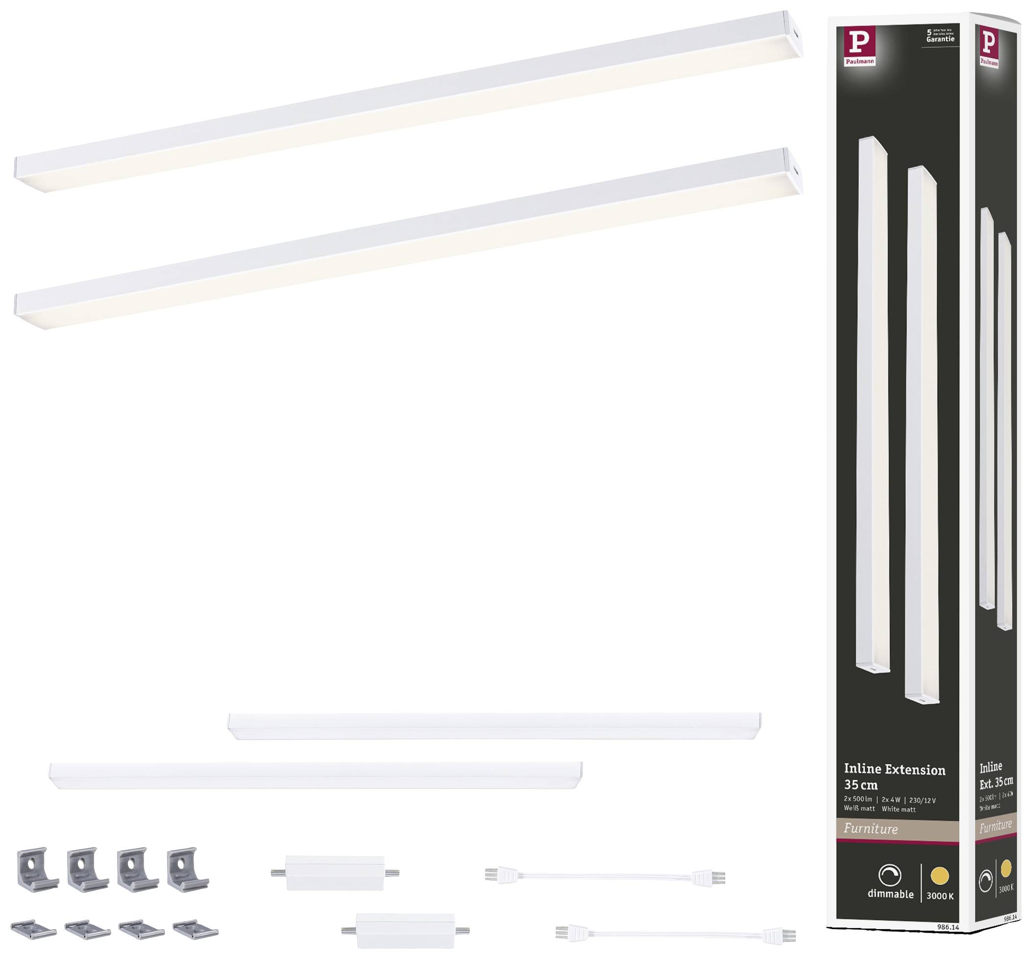 Deux réglettes LED avec matériel de fixation et deux câbles, pour prolonger le système d'éclairage. Emballage visible à droite de l'image.